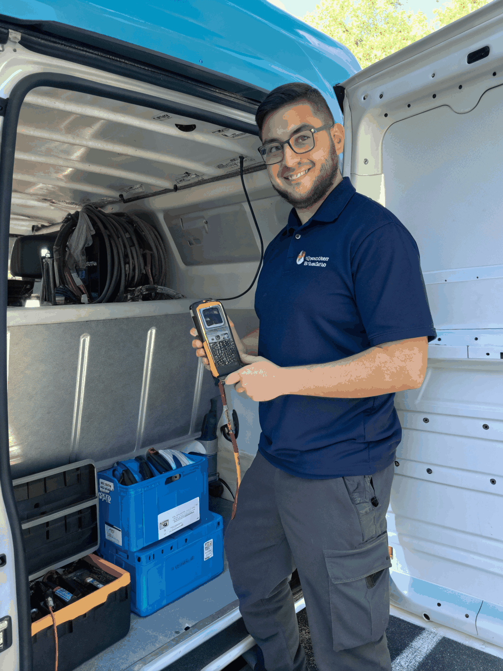Marietta HVAC Pros technicians standing beside a fully equipped service van